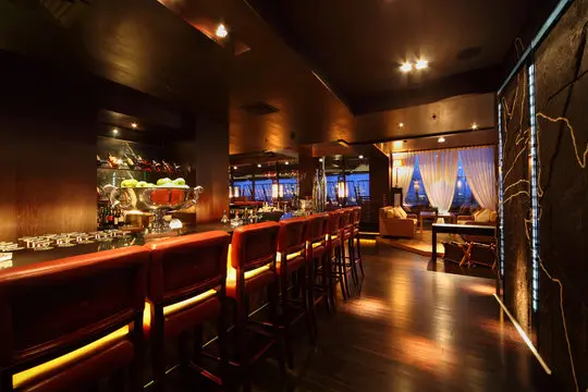 Nightclub AV setup with ambient lighting and professional sound system.