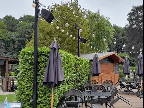 Outdoor entertainment stage with vertical tower lighting systems.